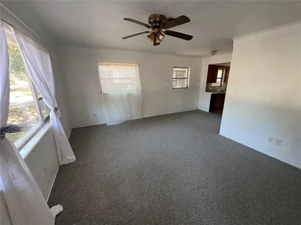 a view of an empty room with a window