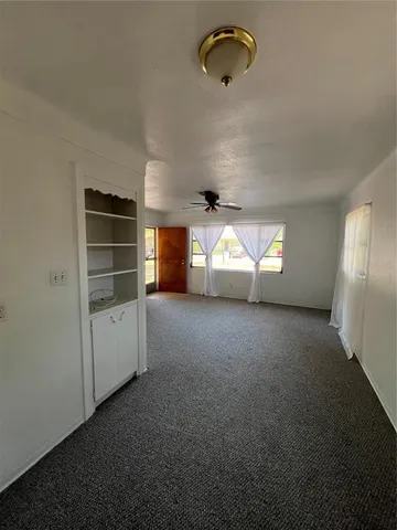 a view of empty room with windows