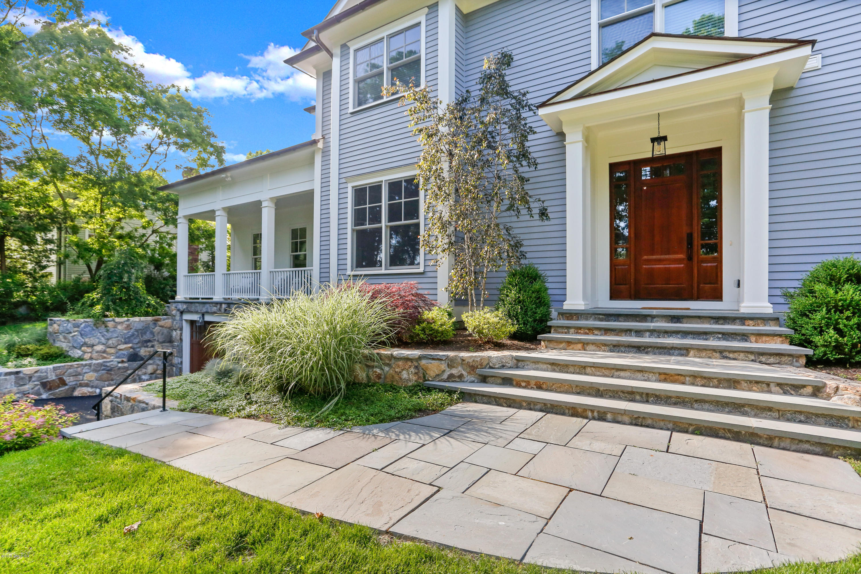 a front view of a house with garden
