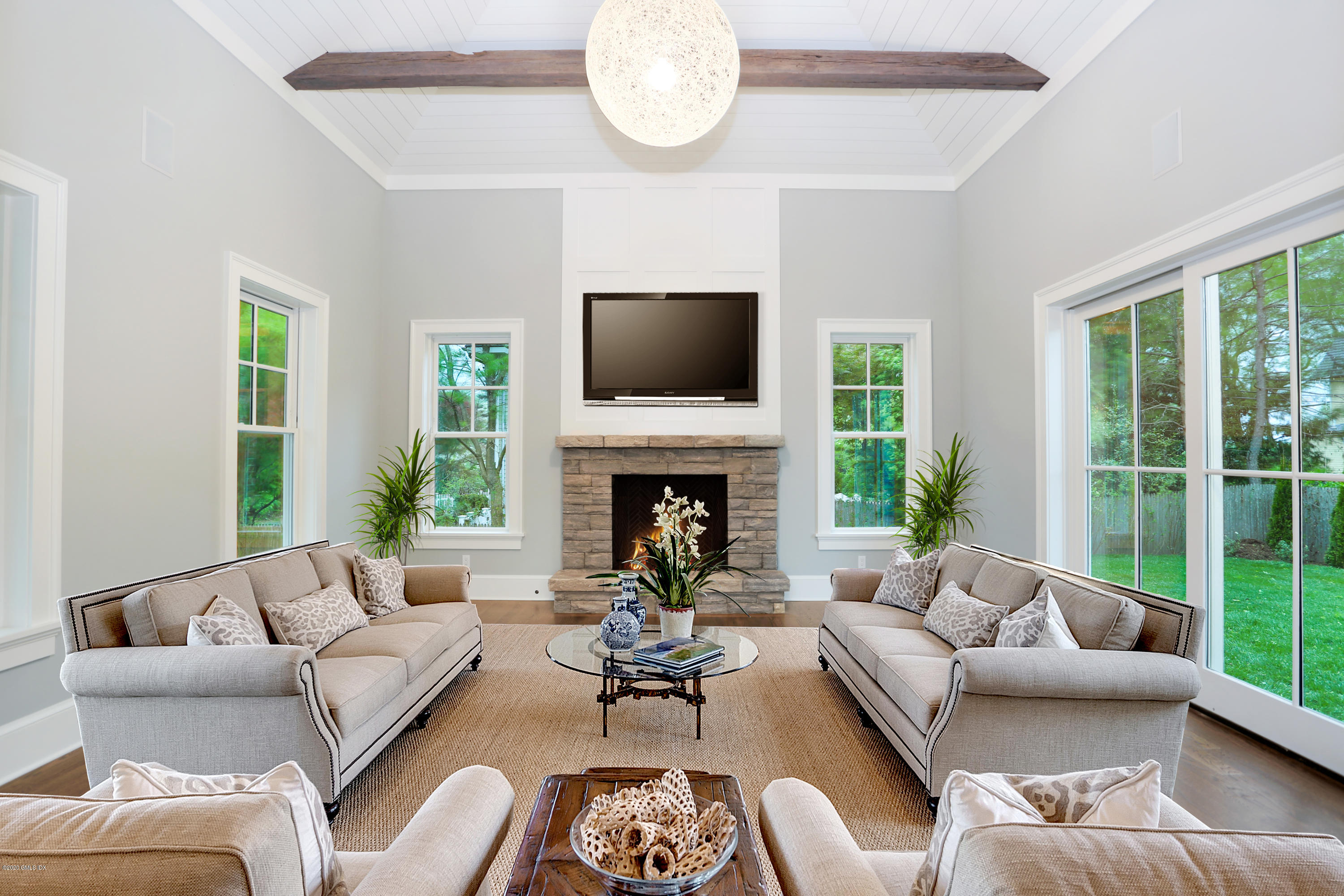 3 Juniper Lane Riverside, CT 06878 - Photo 19 of 46 a living room with furniture fireplace and a large window