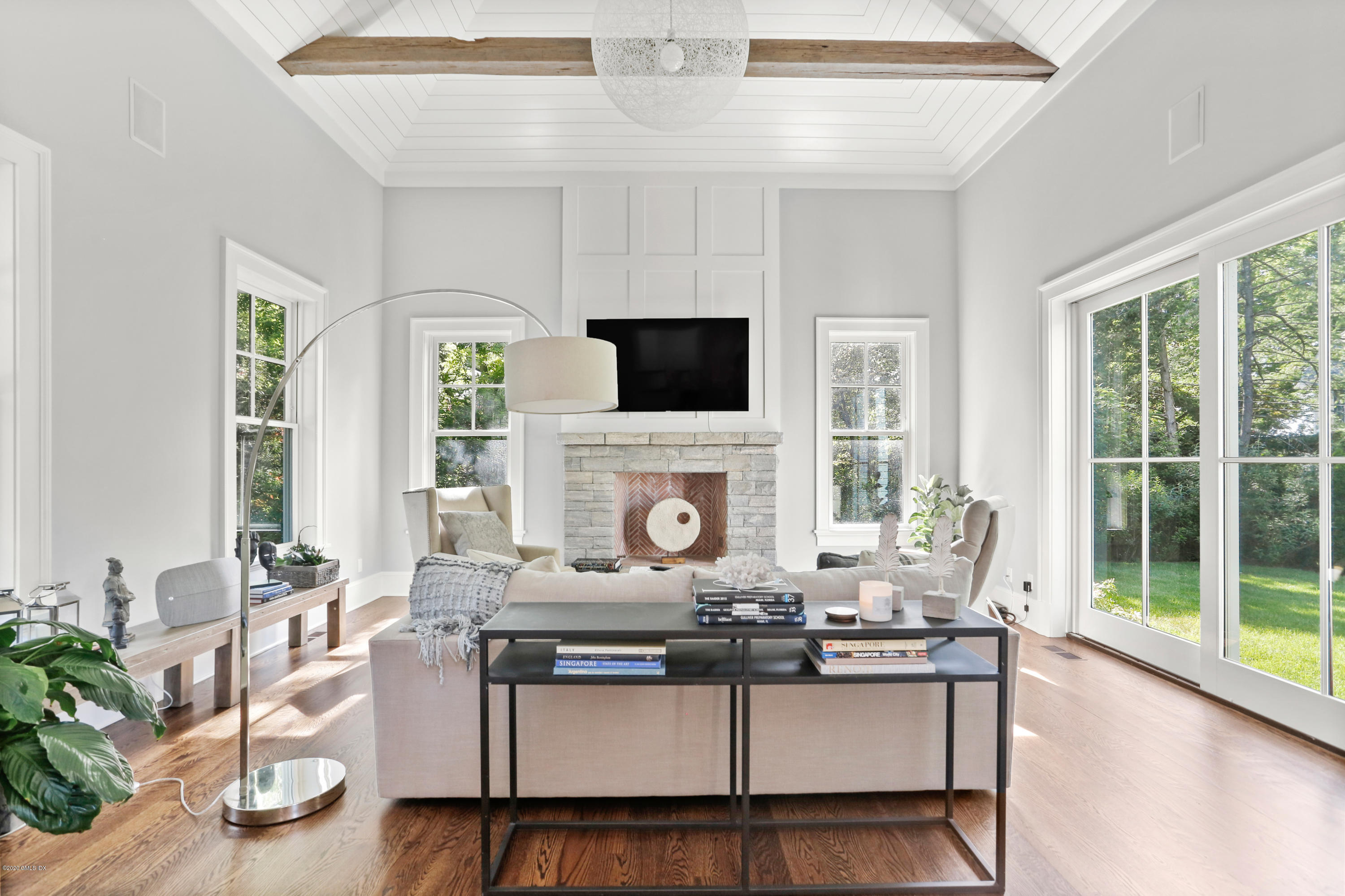 3 Juniper Lane Riverside, CT 06878 - Photo 20 of 46 a living room with a fireplace furniture and a flat screen tv