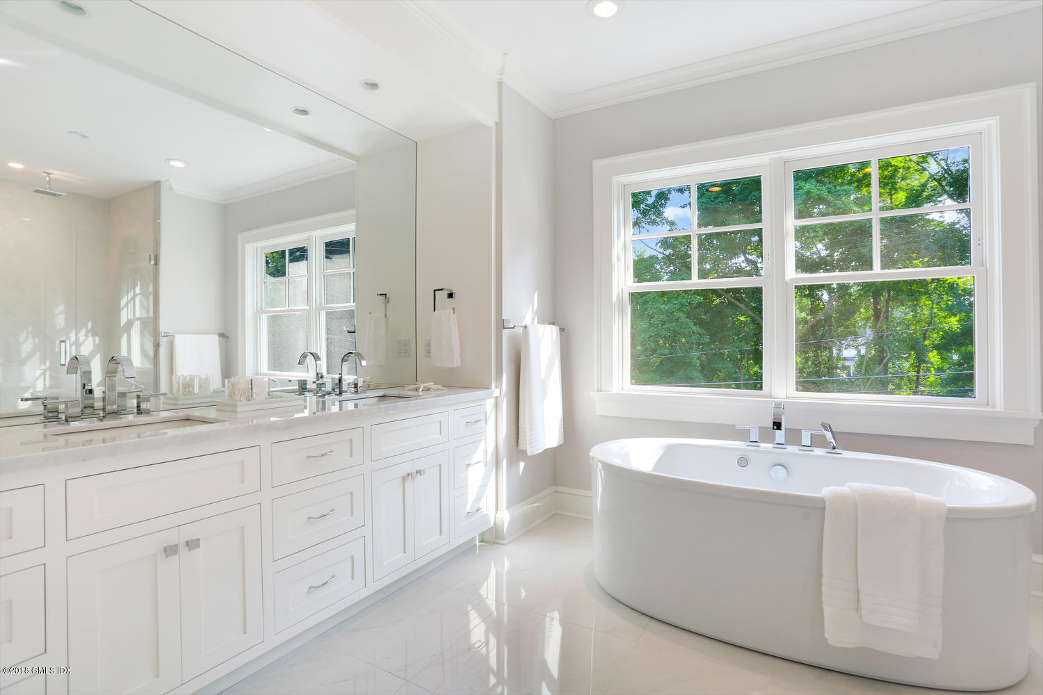 3 Juniper Lane Riverside, CT 06878 - Photo 26 of 46 a spacious bathroom with a double vanity sink a window and a mirror