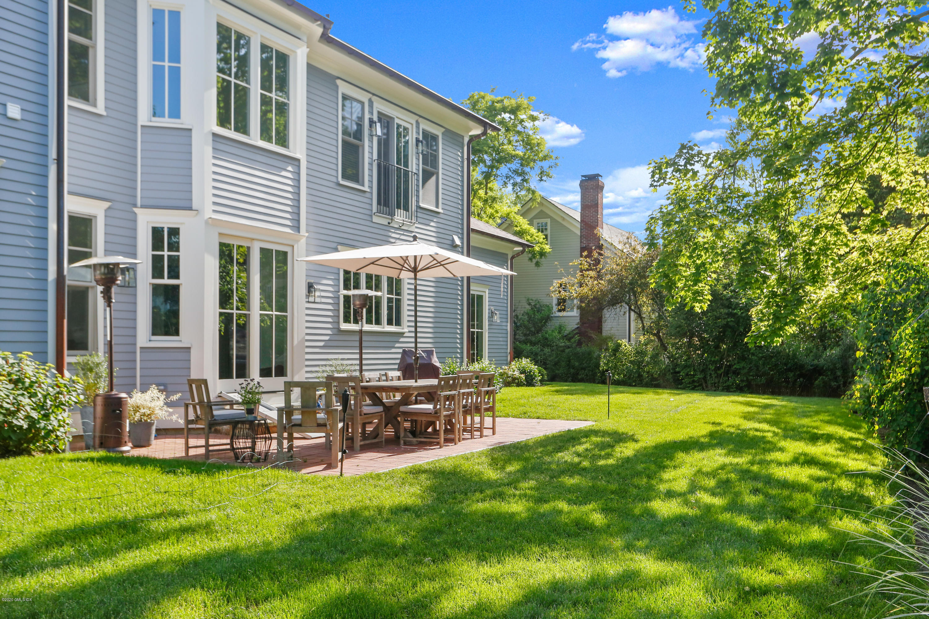 3 Juniper Lane Riverside, CT 06878 - Photo 3 of 46 a view of a house with a yard and sitting area