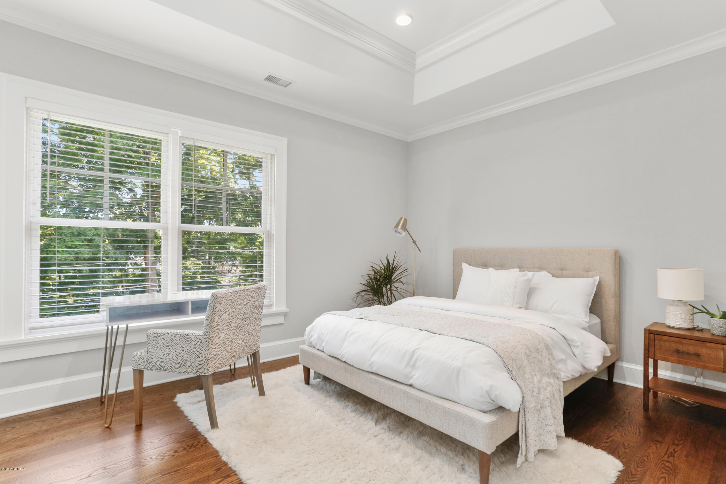 3 Juniper Lane Riverside, CT 06878 - Photo 32 of 46 a bedroom with a bed a table and a large window