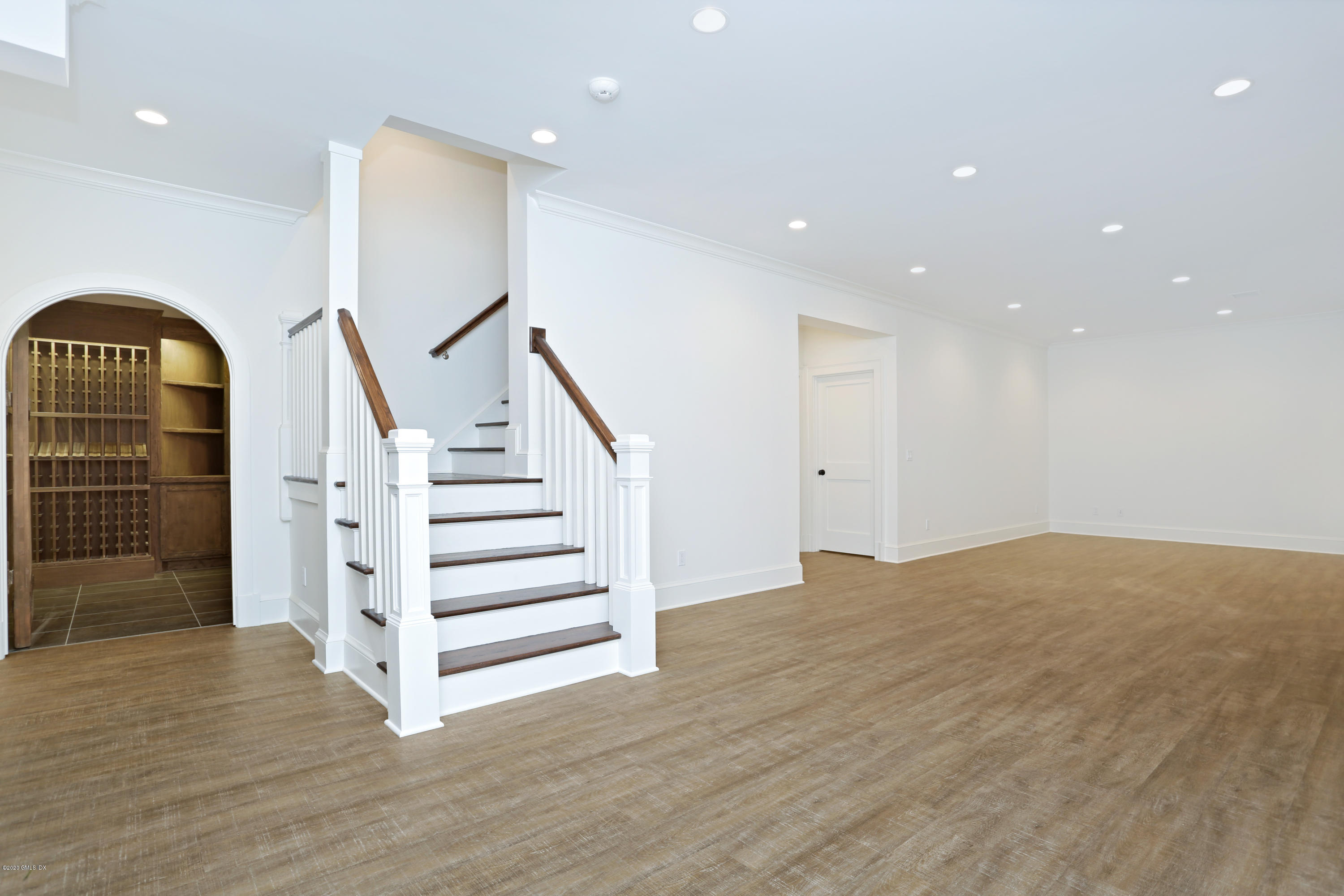 3 Juniper Lane Riverside, CT 06878 - Photo 35 of 46 a view of staircase with white walls and wooden floor