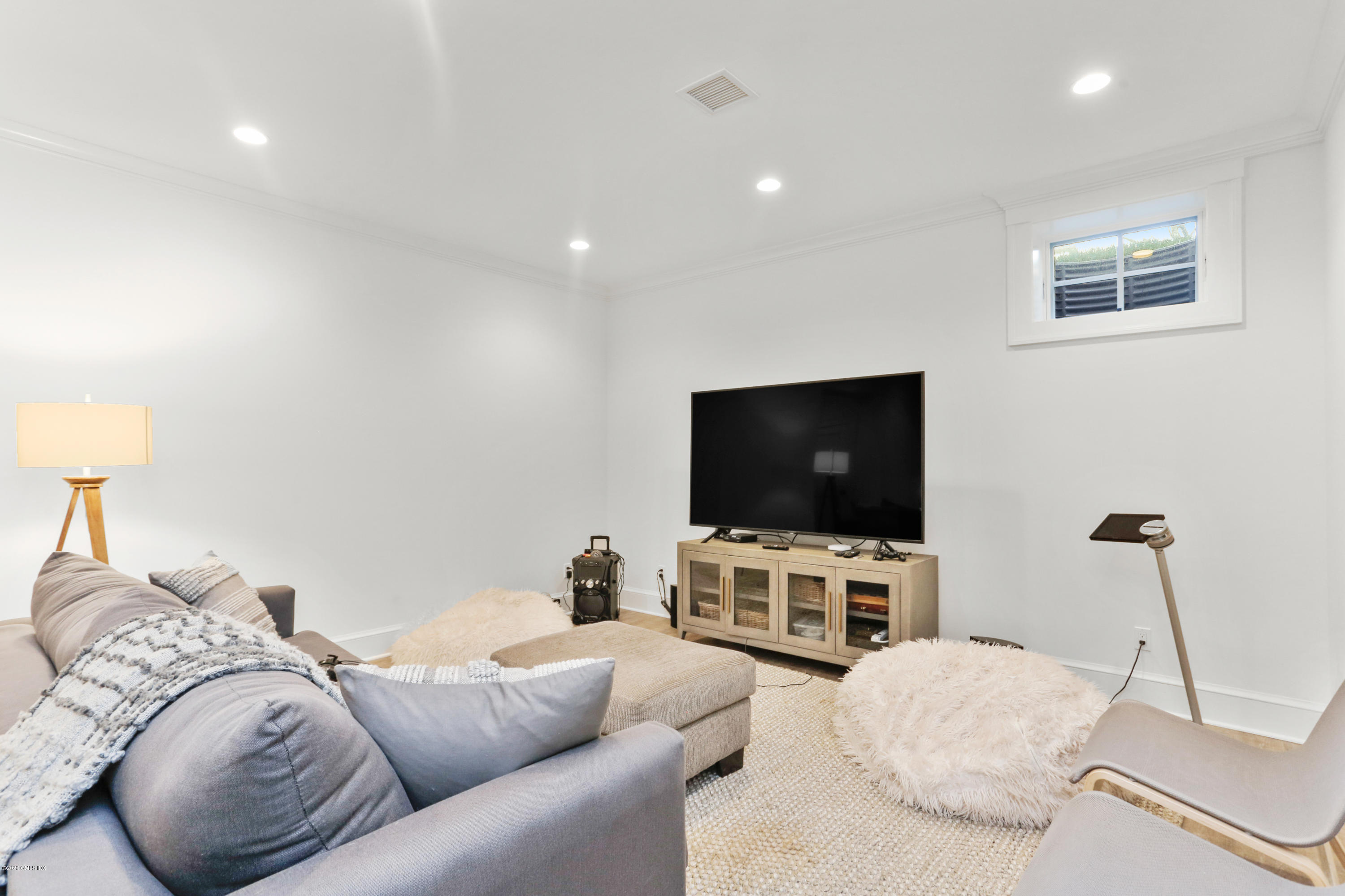 3 Juniper Lane Riverside, CT 06878 - Photo 40 of 46 a living room with furniture and a flat screen tv