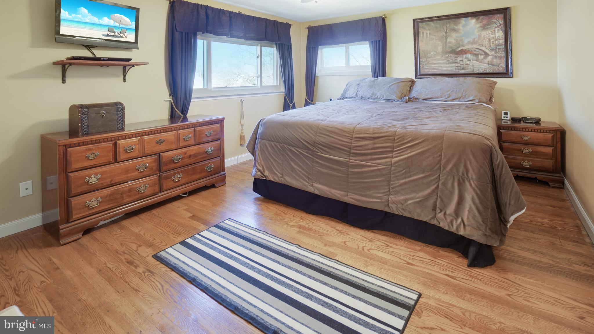 203 Ridgely Road Glen Burnie, MD 21061 - Photo 15 of 35 Spacious Primary Bedroom - Hardwood Floors