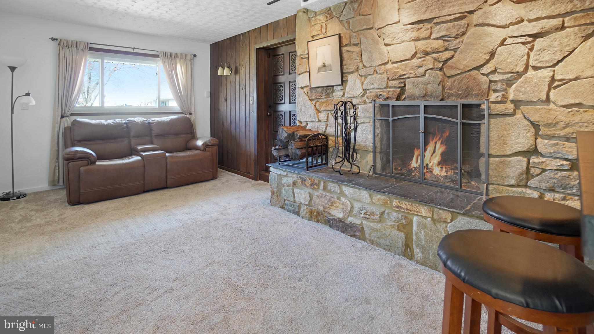 203 Ridgely Road Glen Burnie, MD 21061 - Photo 24 of 35 Family room features beautiful stone hearth