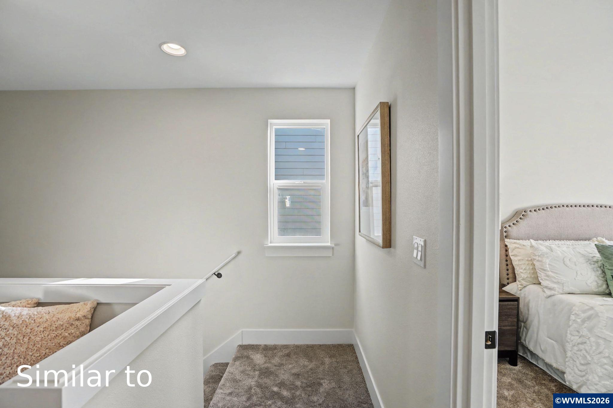 2550 Promise Way Lebanon, OR 97355 - Photo 18 of 35 a view of hallway with window and wooden floor
