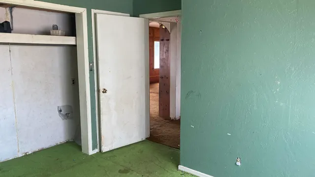 a view of a bathroom with a shower and a sink