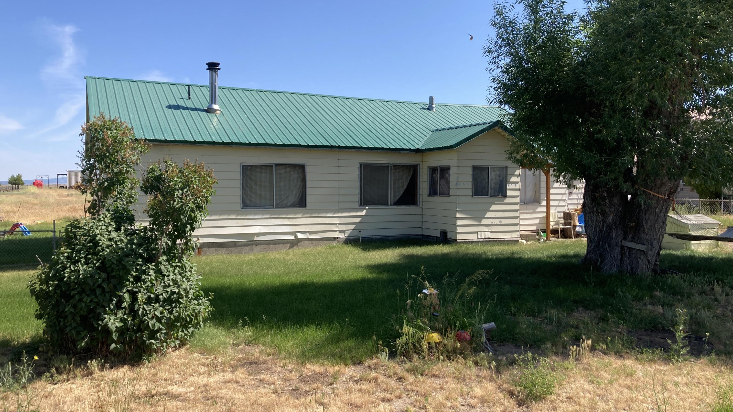 657-525 Susanville Road Bieber, CA 96009 - Photo 2 of 26 a front view of a house with a yard