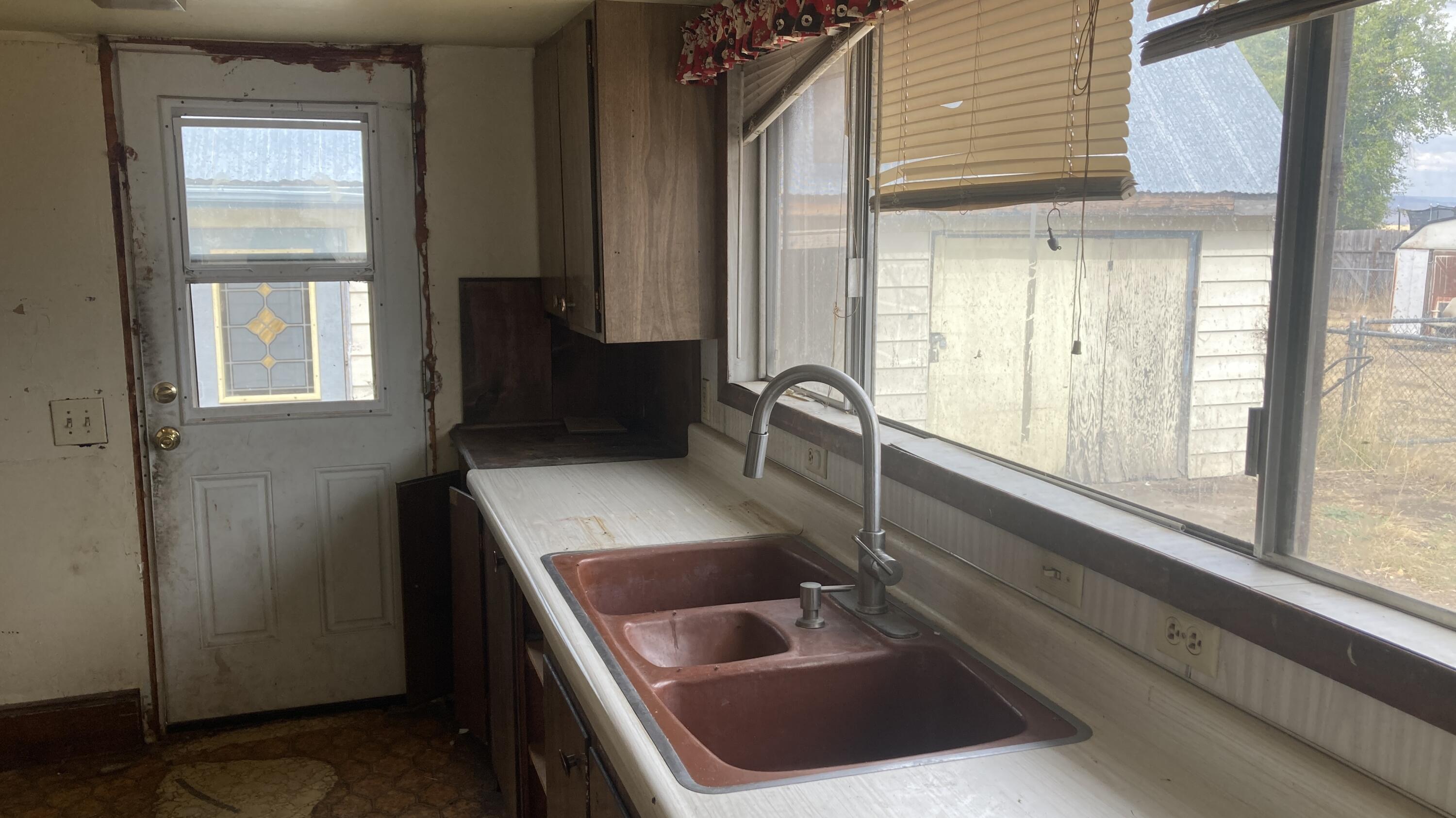 657-525 Susanville Road Bieber, CA 96009 - Photo 22 of 26 a bathroom with a sink a toilet and a window
