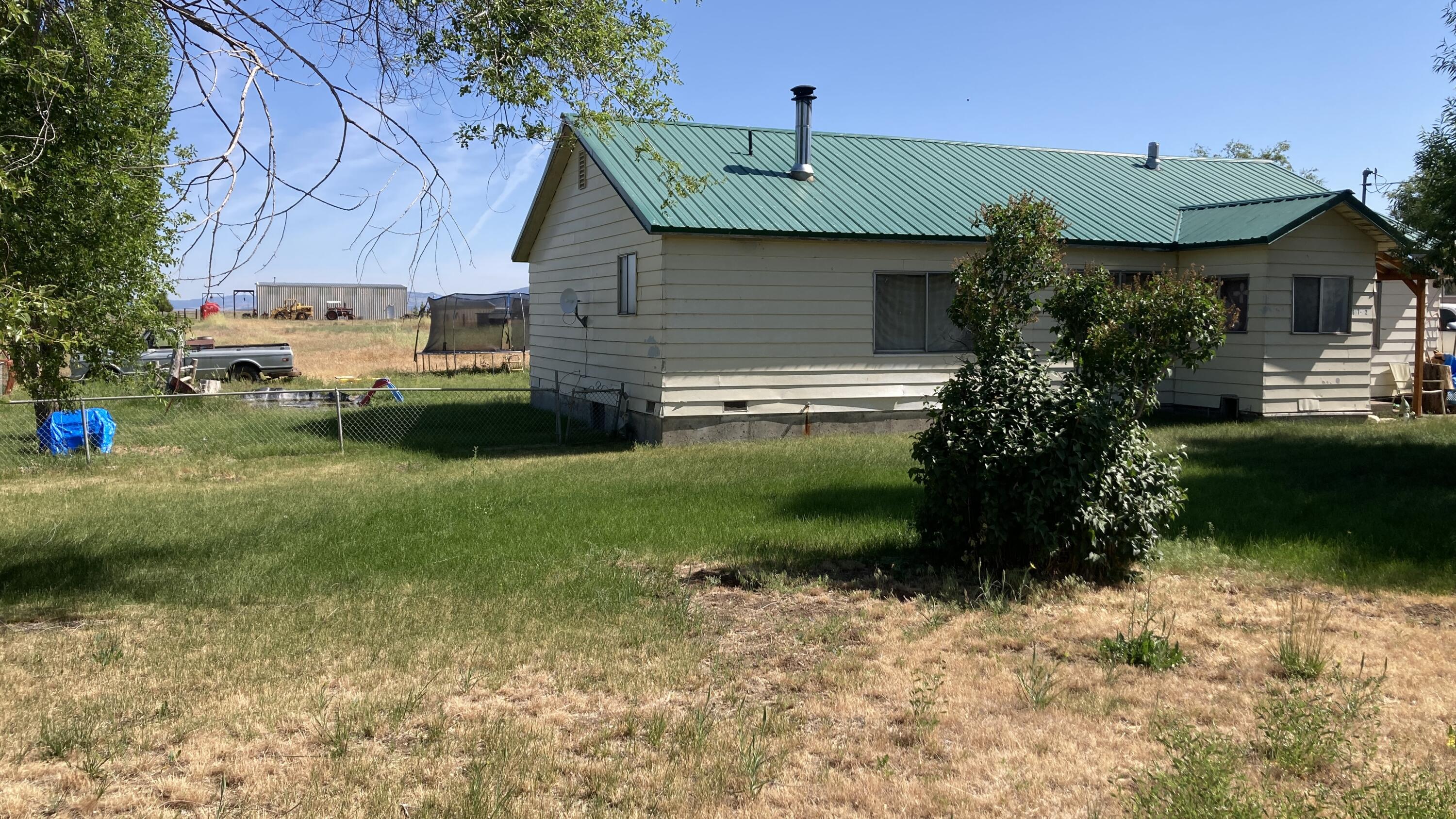 657-525 Susanville Road Bieber, CA 96009 - Photo 4 of 26 a front view of a house with garden