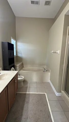 a bathroom with a toilet and a sink
