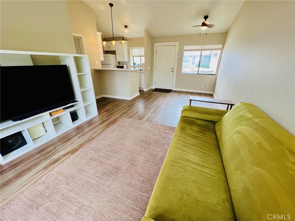 9505 Arlington Avenue, Unit 29 Riverside, CA 92503 - Photo 11 of 21 a living room with a flat screen tv and a fireplace