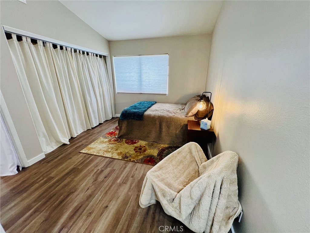 9505 Arlington Avenue, Unit 29 Riverside, CA 92503 - Photo 12 of 21 a bed sitting in a bedroom next to a window