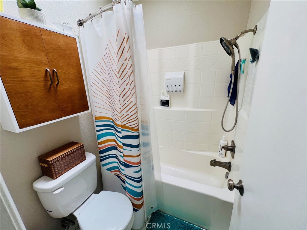 9505 Arlington Avenue, Unit 29 Riverside, CA 92503 - Photo 14 of 21 a bathroom with a toilet and a shower