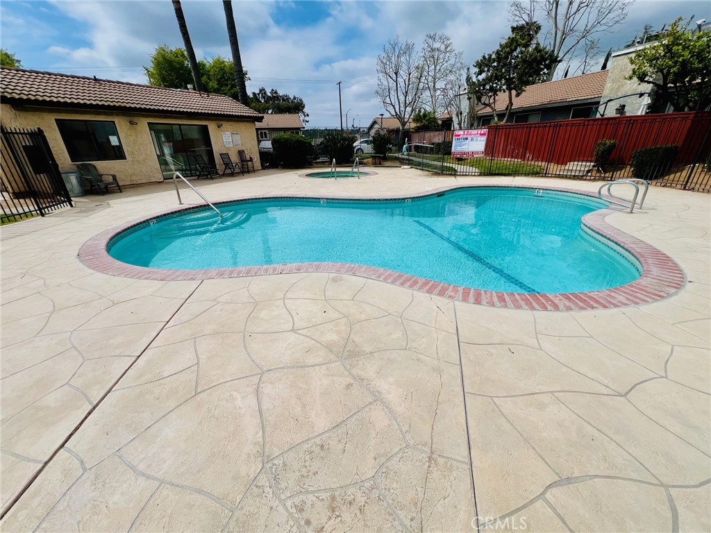 9505 Arlington Avenue, Unit 29 Riverside, CA 92503 - Photo 17 of 21 a swimming pool with outdoor seating yard and barbeque oven