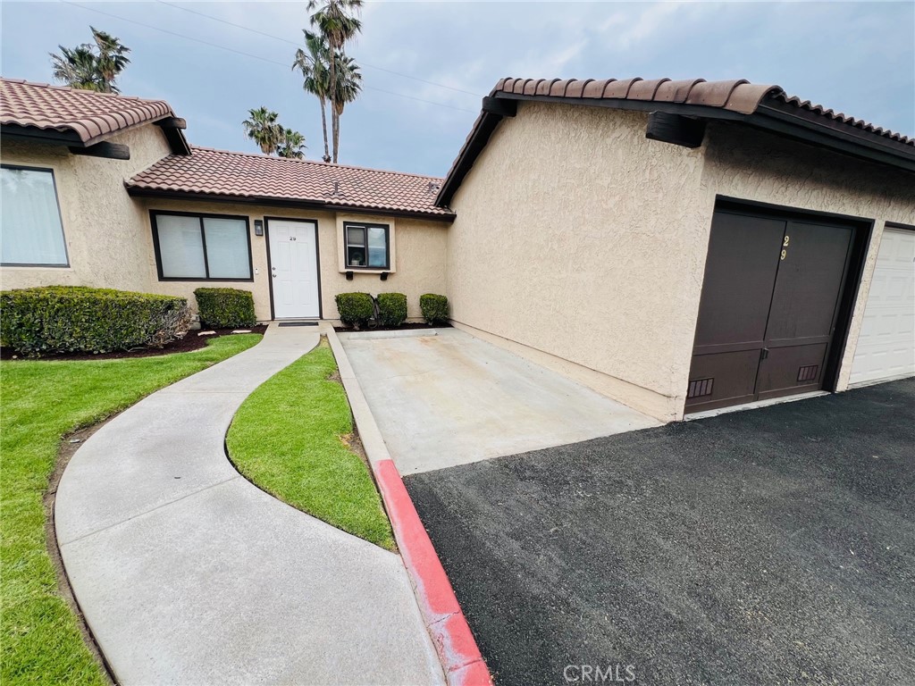9505 Arlington Avenue, Unit 29 Riverside, CA 92503 - Photo 21 of 21 front view of a house with a yard