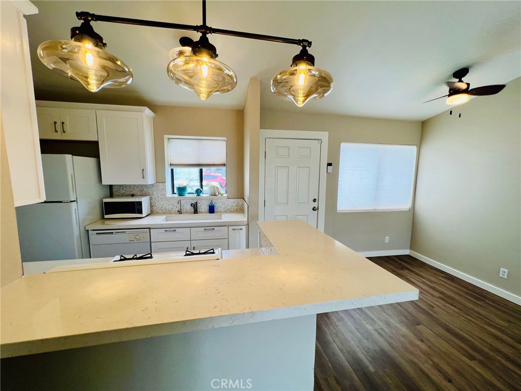 9505 Arlington Avenue, Unit 29 Riverside, CA 92503 - Photo 8 of 21 a kitchen with stainless steel appliances granite countertop a sink and a stove