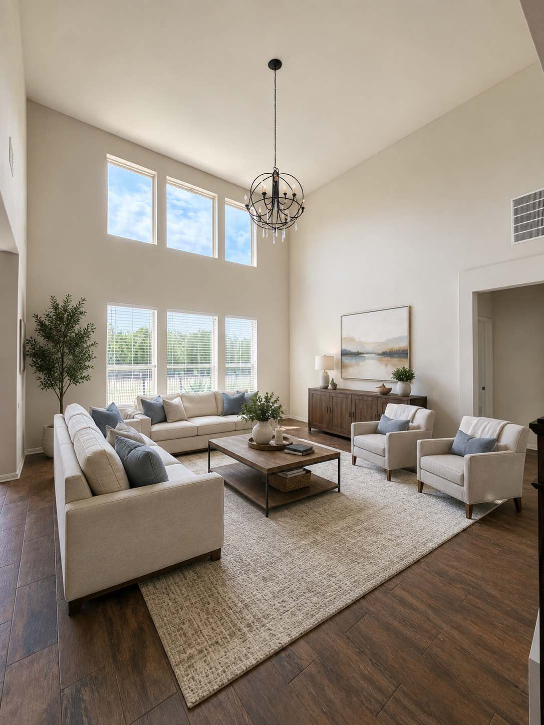 11306 Runnel Ridge Road Manor, TX 78653 - Photo 7 of 15 Soaring ceilings and an abundance of natural light create an inviting atmosphere in this refined living space.
