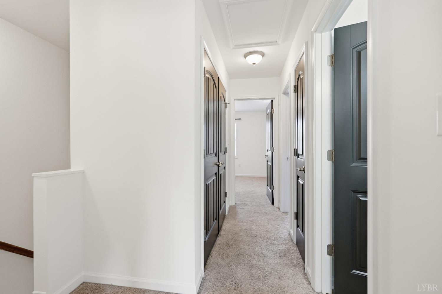1057 Casley Way Forest, VA 24551 - Photo 11 of 27 a view of a hallway with wooden shelves