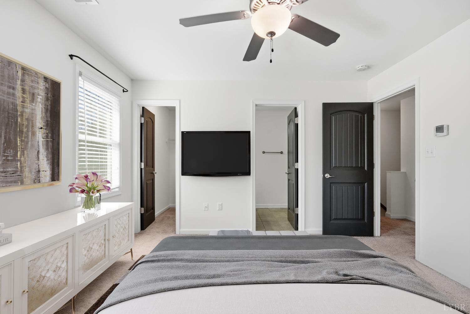 1057 Casley Way Forest, VA 24551 - Photo 13 of 27 a bedroom with a bed and a flat screen tv