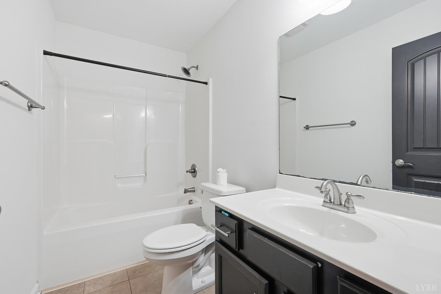 1057 Casley Way Forest, VA 24551 - Photo 15 of 27 a bathroom with a sink toilet a mirror and shower