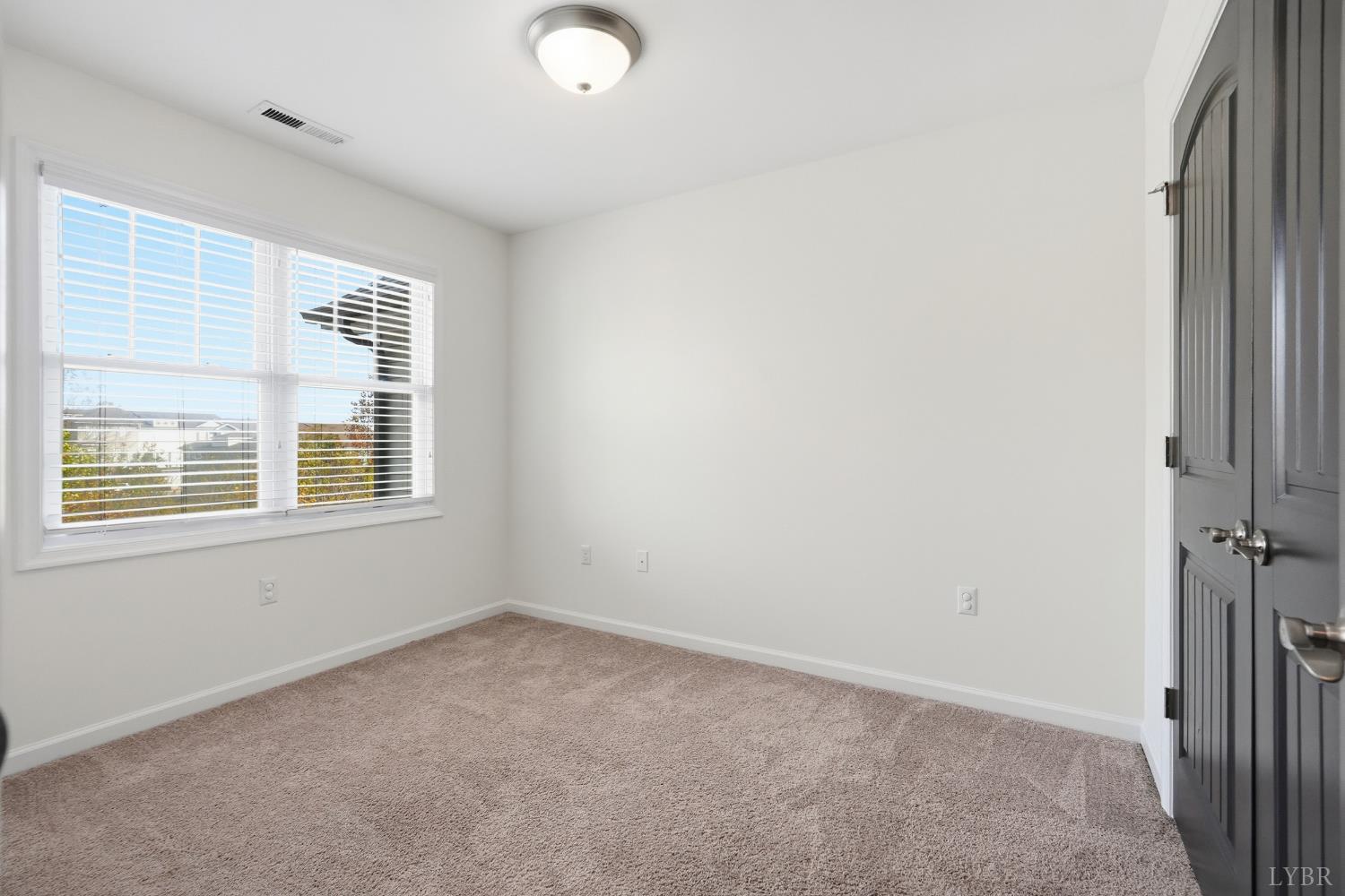 1057 Casley Way Forest, VA 24551 - Photo 16 of 27 an empty room with a window