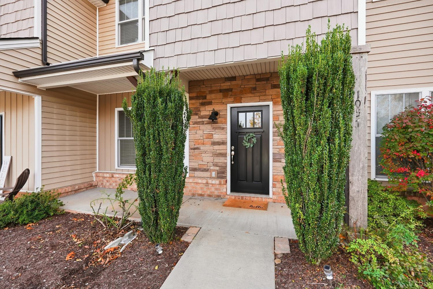 1057 Casley Way Forest, VA 24551 - Photo 2 of 27 a front view of a house with garden