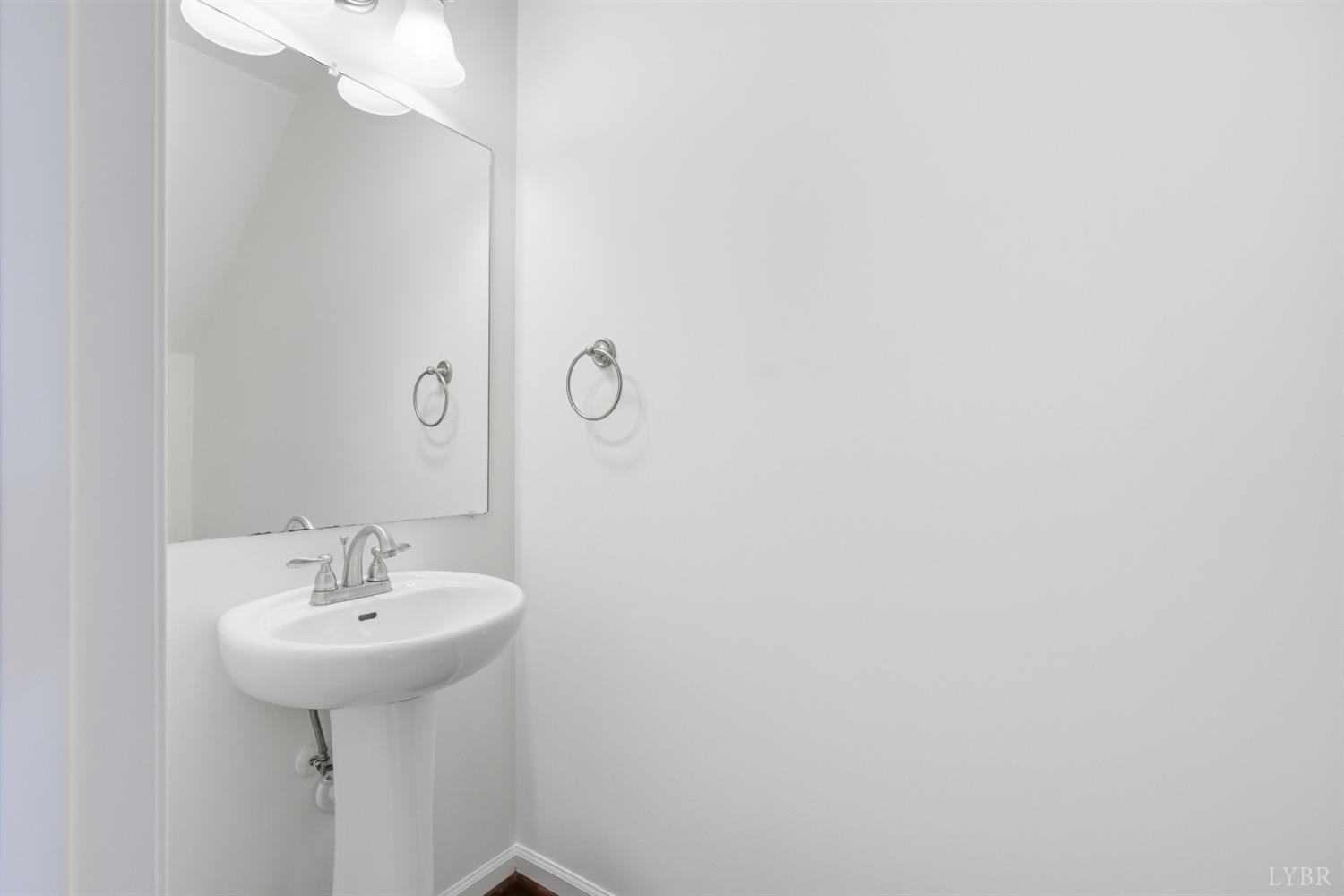1057 Casley Way Forest, VA 24551 - Photo 21 of 27 a bathroom with a sink and a mirror
