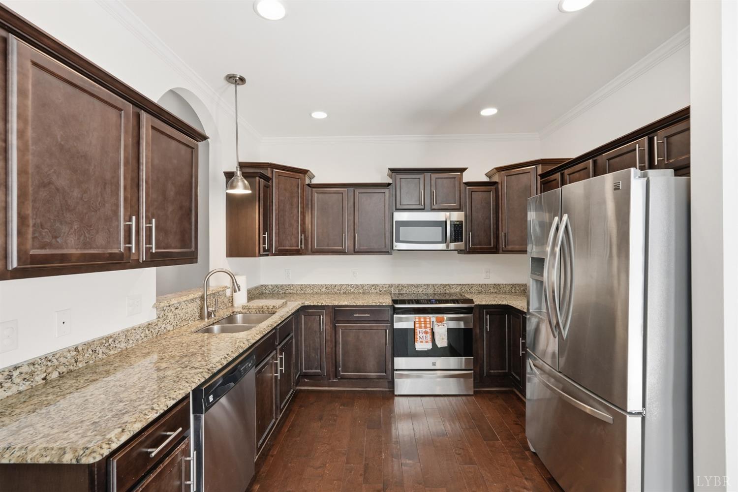 1057 Casley Way Forest, VA 24551 - Photo 8 of 27 a kitchen with stainless steel appliances granite countertop a refrigerator a oven and a sink