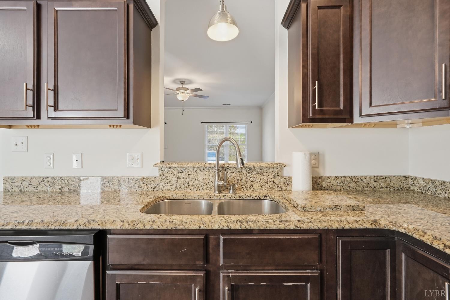 1057 Casley Way Forest, VA 24551 - Photo 9 of 27 a kitchen with granite countertop a sink and cabinets