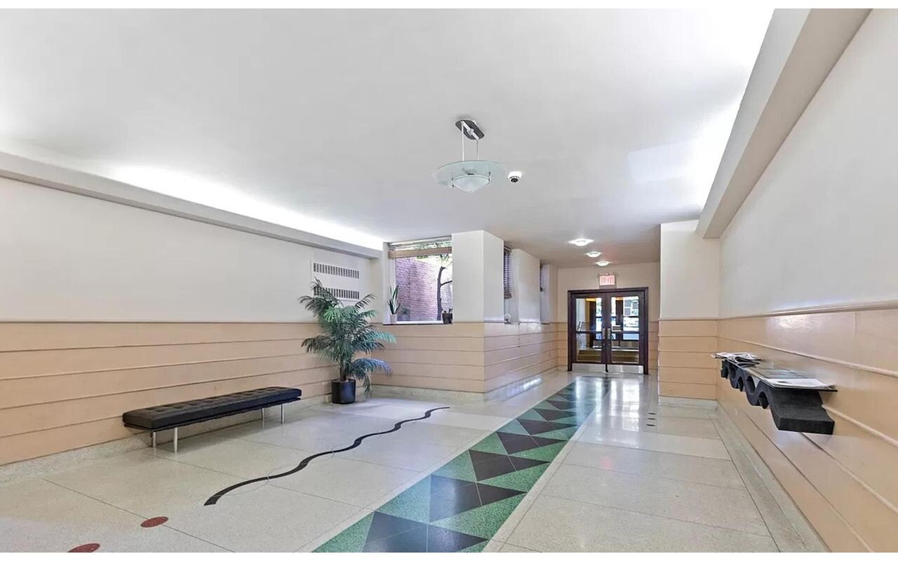 25 Indian Road, Unit 2A Manhattan, NY 10034 - Photo 8 of 11 a lobby with furniture and a potted plant