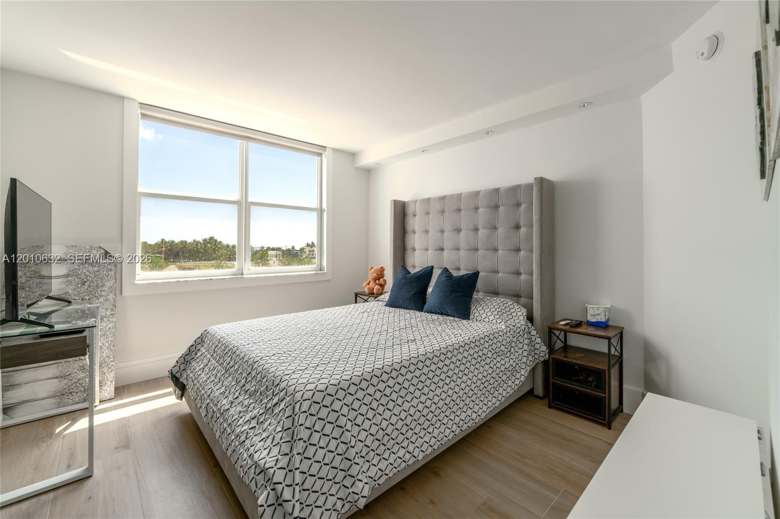 2639 North Riverside Drive, Unit 501 Pompano Beach, FL 33062 - Photo 23 of 39 a bedroom with a bed and a window