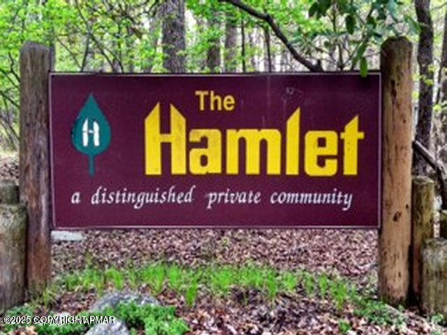 a sign that is sitting on the wooden wall