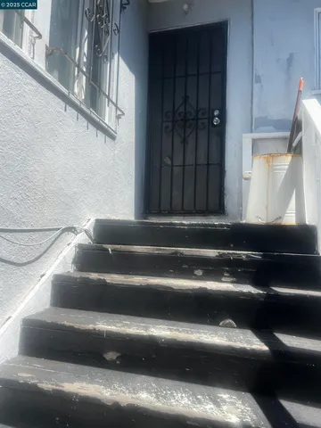 a kitchen with a sink and a stove top oven