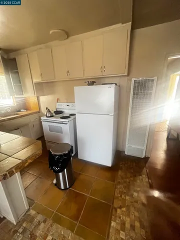 a bedroom with a bed and a mirror