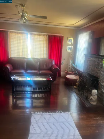 a bedroom with a bed and painting on the wall