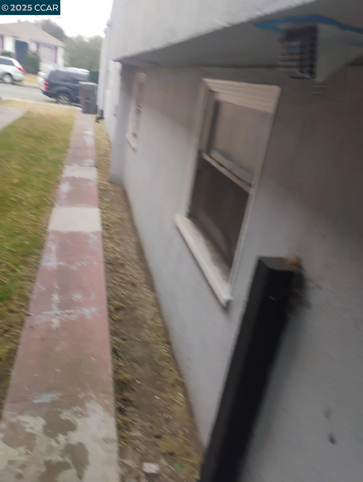 1161 64th Street Oakland, CA 94608 - Photo 33 of 34 a hallway with front door
