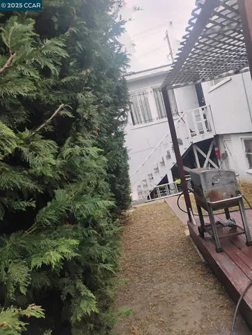 a view of a patio with a table and chairs