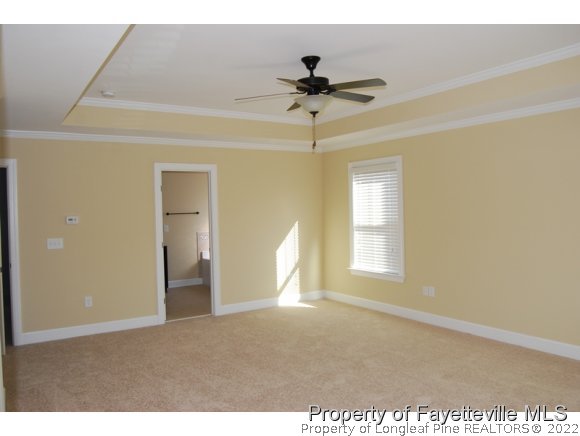 1014 Micahs Way North Spring Lake, NC 28390 - Photo 16 of 25 a view of empty room with windows and ceiling fan