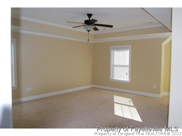 1014 Micahs Way North Spring Lake, NC 28390 - Photo 20 of 25 a view of an empty room with a ceiling fan and window