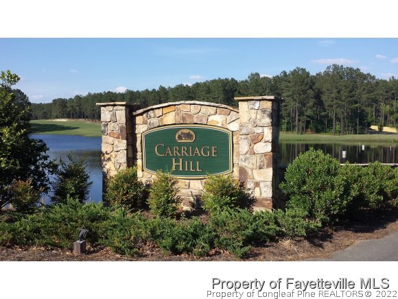 1014 Micahs Way North Spring Lake, NC 28390 - Photo 23 of 25 a sign that is sitting in front of flowers