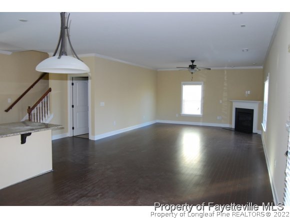1014 Micahs Way North Spring Lake, NC 28390 - Photo 6 of 25 a view of wooden floor and windows in a room