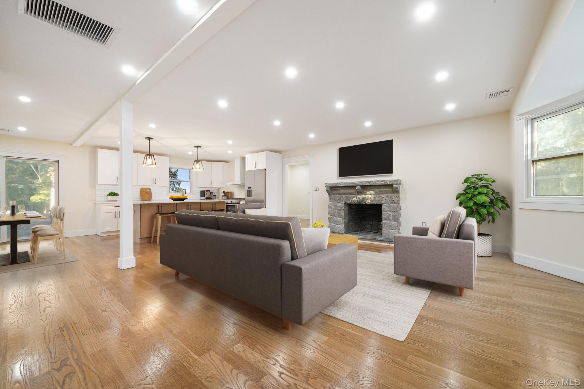 16 Bramblebrook Road Ardsley, NY 10502 - Photo 5 of 32 a living room with furniture a fireplace and a flat screen tv