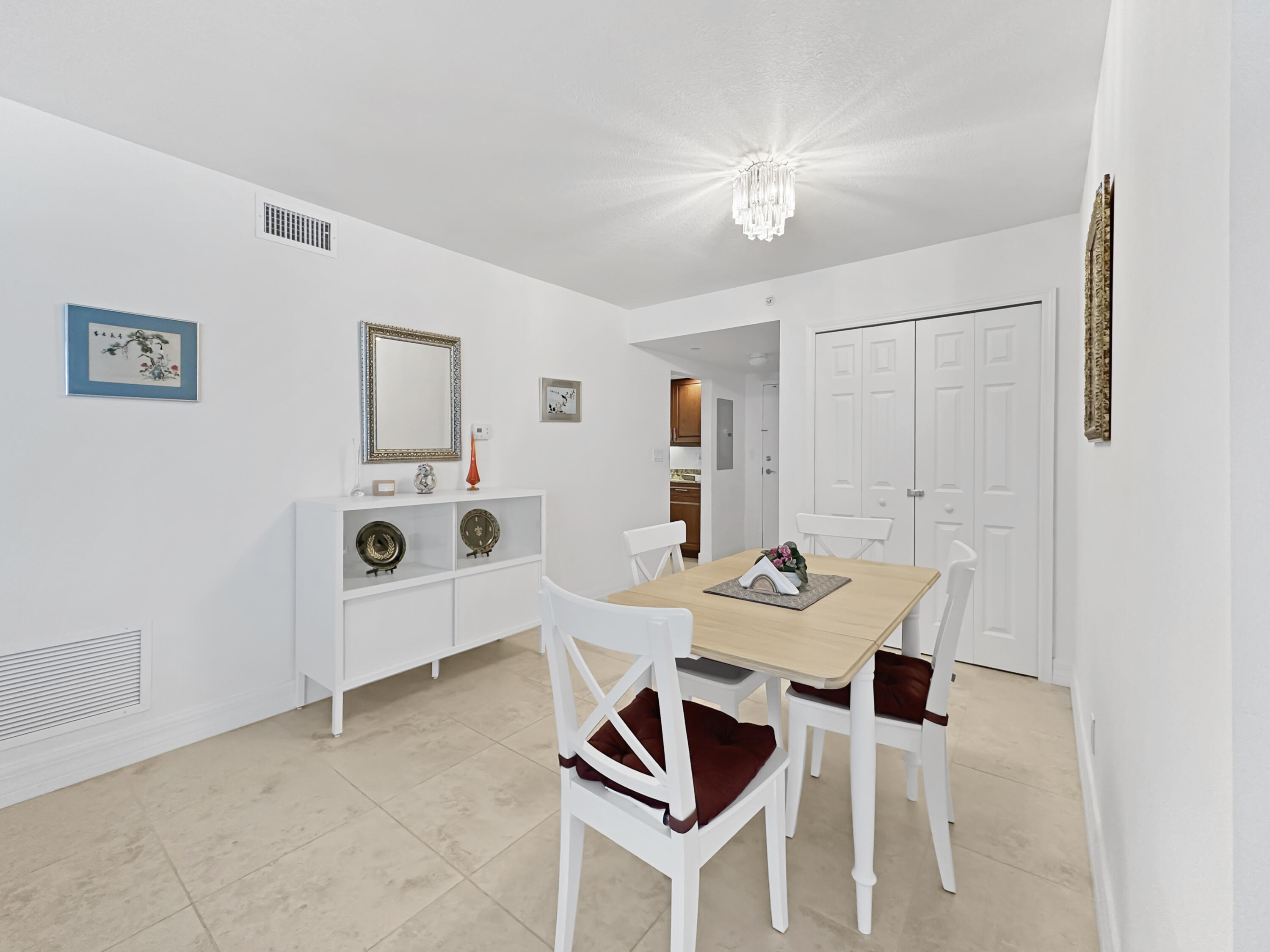 3000 North Ocean Drive, Unit 6B Singer Island, FL 33404 - Photo 2 of 47 a table and chairs in a room