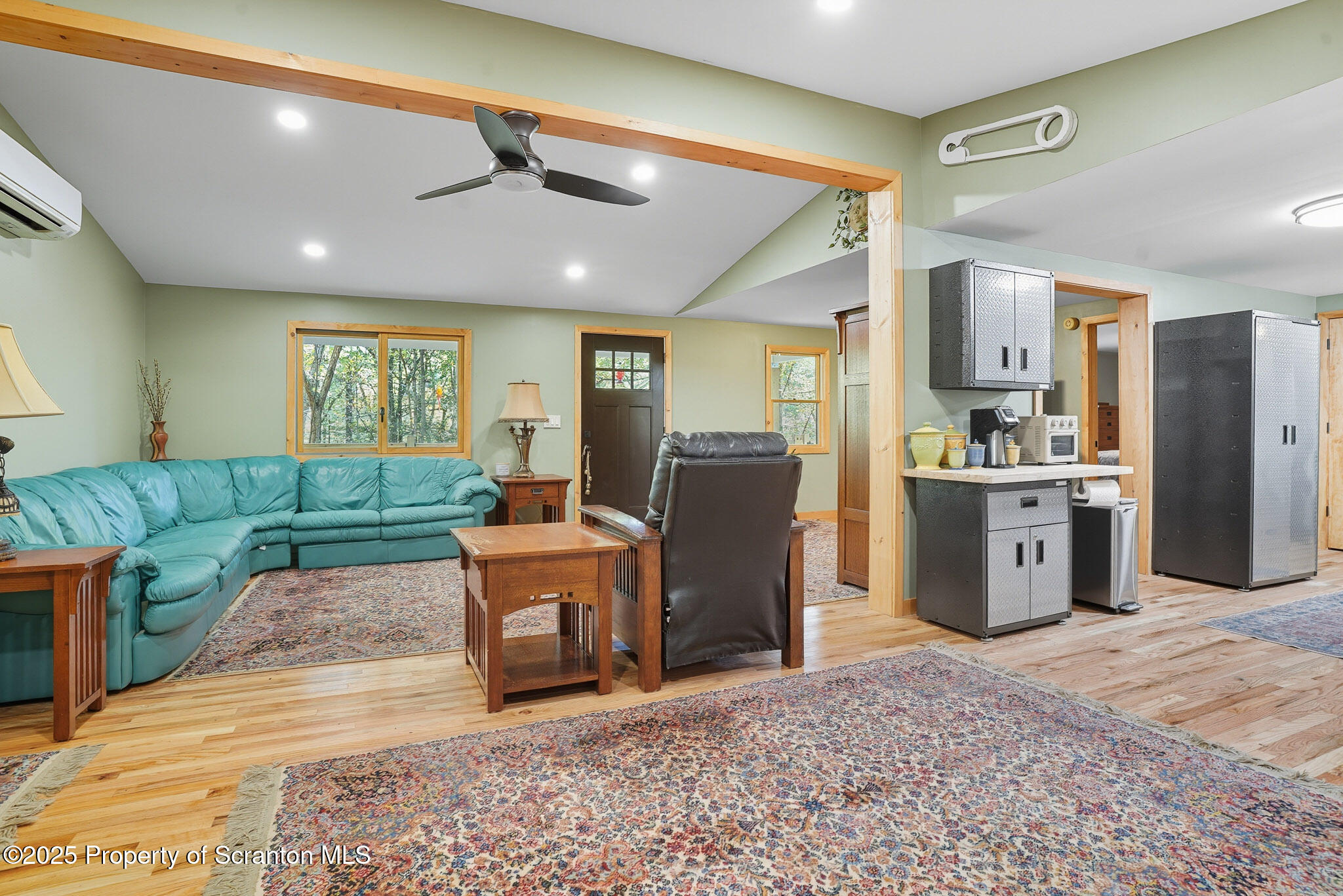 452 Engvaldsen Road Hawley, PA 18428 - Photo 13 of 42 a living room with furniture a large window with kitchen view