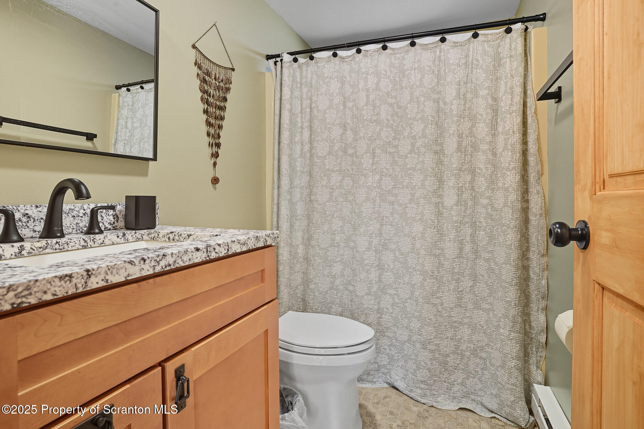 452 Engvaldsen Road Hawley, PA 18428 - Photo 16 of 42 a bathroom with a granite countertop sink toilet and shower