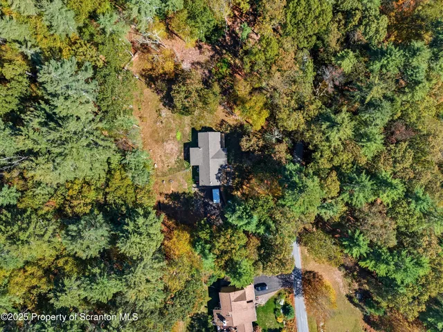 an aerial view of residential house with outdoor space